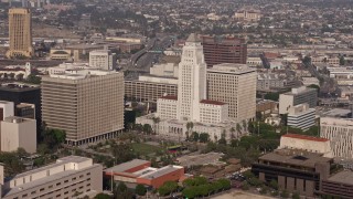 AX43_024 - 4K aerial stock footage flying by Bank of America Center to reveal Los Angeles City Hall, Downtown Los Angeles, California