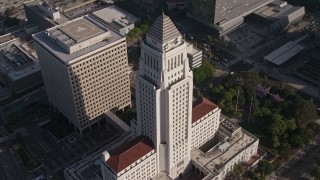 AX43_025E - 4K aerial stock footage orbiting Los Angeles City Hall, Downtown Los Angeles, California