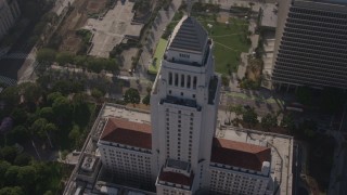 AX43_026 - 4K aerial stock footage orbiting the top of Los Angeles City Hall, Downtown Los Angeles. California