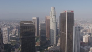 AX43_036 - 4K aerial stock footage flying over downtown skyscrapers to approach City National Plaza, US Bank Tower, and Aon Center, Downtown Los Angeles, California