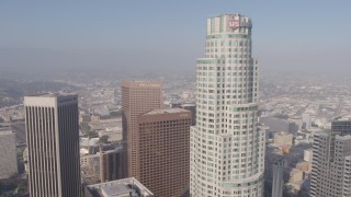 AX43_037 - 4K aerial stock footage flying between City National Plaza and Aon Center to approach US Bank Tower, Downtown Los Angeles, California