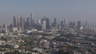 AX43_044 - 4K aerial stock footage approaching the towering skyline of Downtown Los Angeles, California from Westlake