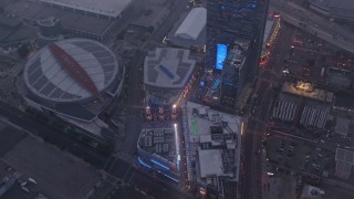 AX44_046 - 4K stock footage aerial video of a wide shot of Staples Center and Nokia Theater, Downtown Los Angeles, twilight