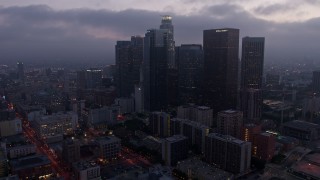 AX44_053 - 4K aerial stock footage approaching City Hall and revealing skyline, Downtown Los Angeles, twilight
