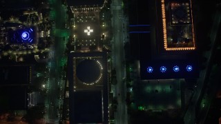 AX44_083 - 4K aerial stock footage of a bird's eye over city streets and buildings, Downtown Los Angeles, night