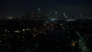 AX44_088 - 4K aerial stock footage approaching skyline, Downtown Los Angeles, night