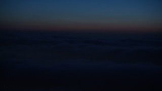 AX44_092 - 4K aerial stock footage of the marine layer over city, Los Angeles, California, night