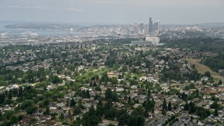 AX45_009 - 5K aerial stock footage of Seattle skyline seen from residential neighborhoods, Beacon Hill, Seattle, Washington