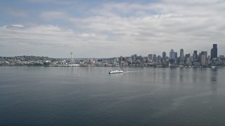 AX45_020 - 5K aerial stock footage tracking a ferry sailing across Elliott Bay near Downtown Seattle, Washington