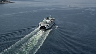 AX45_023E - 5K aerial stock footage tracking a ferry sailing across Elliott Bay, Seattle, Washington