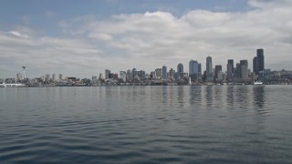 AX45_039 - 5K aerial stock footage tilting up from Elliott Bay to reveal Downtown Seattle skyline, Washington
