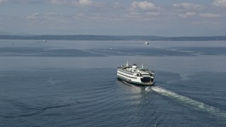 AX45_043E - 5K aerial stock footage tracking a ferry sailing Elliott Bay, Seattle