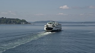 AX45_045 - 5K aerial stock footage tracking a passenger ferry sailing Elliott Bay, Seattle, Washington