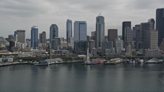 AX45_048 - 5K aerial stock footage approaching the Seattle Aquarium, Great Wheel and Downtown Seattle skyline, Washington