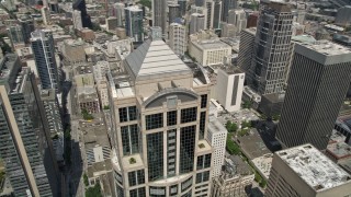 AX45_051 - 5K aerial stock footage tilting to reveal and track 1201 Third Avenue Tower in Downtown Seattle, Washington