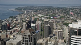 AX45_052 - 5K aerial stock footage of the Space Needle seen while flying by downtown skyscrapers, Downtown Seattle, Washington