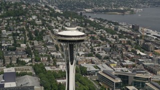 AX45_053E - 5K aerial stock footage approach and flyby the iconic Space Needle towering over the city, Downtown Seattle, Washington