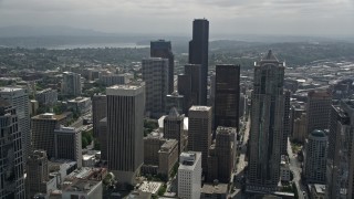 AX45_058E - 5K aerial stock footage flying over high-rises to approach Columbia Center in Downtown Seattle, Washington