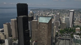 AX45_066 - 5K aerial stock footage flying over downtown buildings to approach the Space Needle, Downtown Seattle, Washington