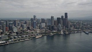 AX45_072E - 5K stock footage aerial video approaching the Waterfront and Downtown Seattle skyline from Elliott Bay, Washington