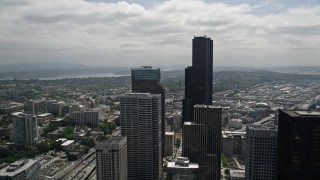 AX45_076 - 5K aerial stock footage orbiting Seattle Municipal Tower and Columbia Center, Downtown Seattle, Washington