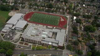 AX45_079 - 5K stock footage aerial video of a bird's eye view of Garfield High School and football field, Central Seattle, Washington