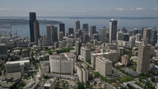 AX45_085E - 5K aerial stock footage flying over Seattle University campus to approach Downtown Seattle, Washington