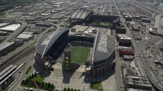 AX45_091E - 5K stock footage aerial video flying by CenturyLink Field, with a view of the field inside the stadium, Downtown Seattle, Washington