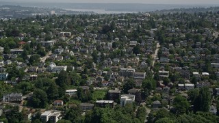 AX45_104 - 5K aerial stock footage of flying by a suburban neighborhood in Magnolia, Seattle, Washington