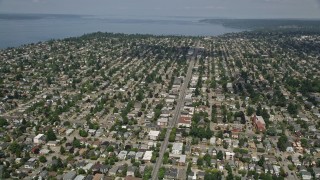 AX45_108 - 5K aerial stock footage of following a street past suburban neighborhoods in Ballard, Washington