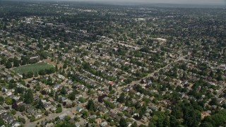 AX45_109 - 5K aerial stock footage of flying by suburban neighborhoods, Ballard, Washington