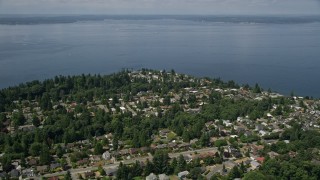 AX45_111E - 5K aerial stock footage flyby suburban homes by the shore of Puget Sound, Ballard, Washington