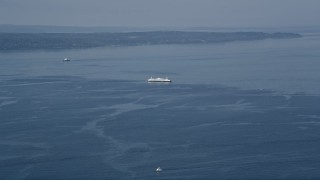 AX45_119 - Aerial stock footage of 5K aerial  video flyby a ferry sailing on Puget Sound, Washington