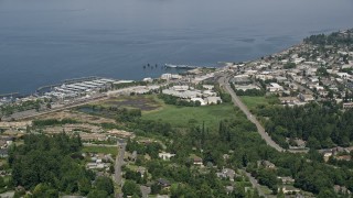 AX45_121 - 5K aerial stock footage of approaching office buildings and piers in Edmonds, Washington