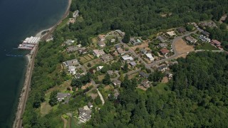 AX45_128 - 5K stock footage aerial video approach mansions by Beach Camp at Sunset Bay, Edmonds, Washington