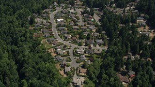 AX45_129 - 5K aerial stock footage pass by a suburban neighborhood and trees, Lynnwood, Washington