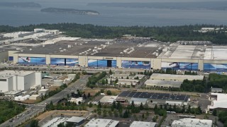 AX45_142 - 5K stock footage aerial video of Boeing Everett Factory airplane assembly building, Paine Field, Washington