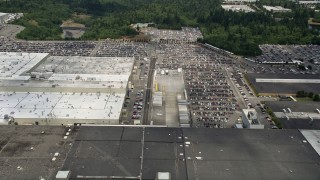AX45_145 - 5K stock footage aerial video fly over Boeing Everett Factory to approach parking lots, Paine Field, Washington