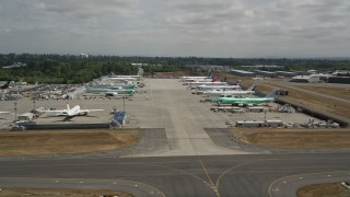 AX45_150 - 5K stock footage aerial video of rows of commercial airplanes parked at Paine Field, Washington