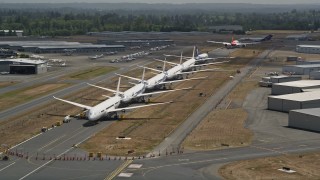 AX45_151 - 5K aerial stock footage flyby six commercial airliners in a row at Paine Field, Washington