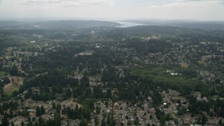AX46_011 - 5K stock footage aerial video fly over suburban neighborhoods with trees, Brier, Washington