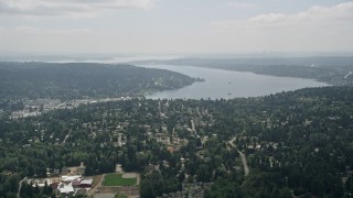 AX46_013 - 5K stock footage aerial video approach suburban houses and Lake Washington, Brier, Washington