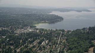 AX46_020E - 5K aerial stock footage flying by a residential neighborhood on the shore of Lake Washington, Kirkland, Washington