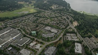 AX46_028 - 5K aerial stock footage approaching lakefront apartment buildings by the shore of Lake Sammamish, Redmond, Washington