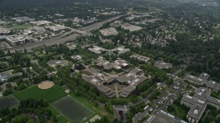 AX46_037 - 5K aerial stock footage reverse view of office buildings at the Microsoft Headquarters campus, Redmond, Washington