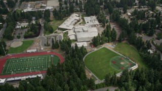 AX46_038 - 5K aerial stock footage flying by sports fields and Interlake High School, Bellevue, Washington