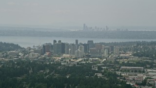 AX46_039 - 5K aerial stock footage of skyscrapers in Downtown Bellevue, Seattle skyline in the far distance, Washington