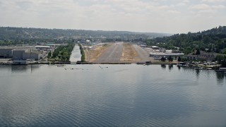 AX46_052 - 5K aerial stock footage of approaching Renton Municipal Airport runway from Lake Washington, Washington