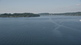 AX47_003 - 5K aerial stock footage fly over Lake Washington to approach Mercer Island, Washington