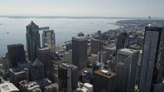 AX47_020E - 5K aerial stock footage approach and fly over Rainier Tower, skyscrapers and high-rises toward the bay in Downtown Seattle, Washington